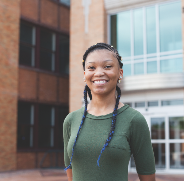 Student smiling at the camera