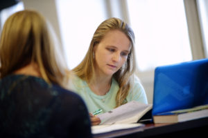 Student studies at a desk